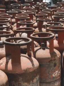 rows of rusty gas cylinders in nepal