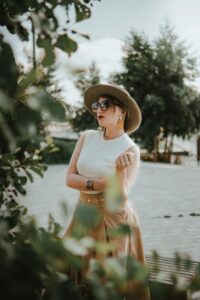 stylish woman in hat outdoors in lille