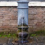 historic nasone water fountain in rome italy