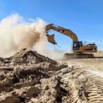 stockcake-excavator_dumping_sand-1121307-medium4922440936580240492